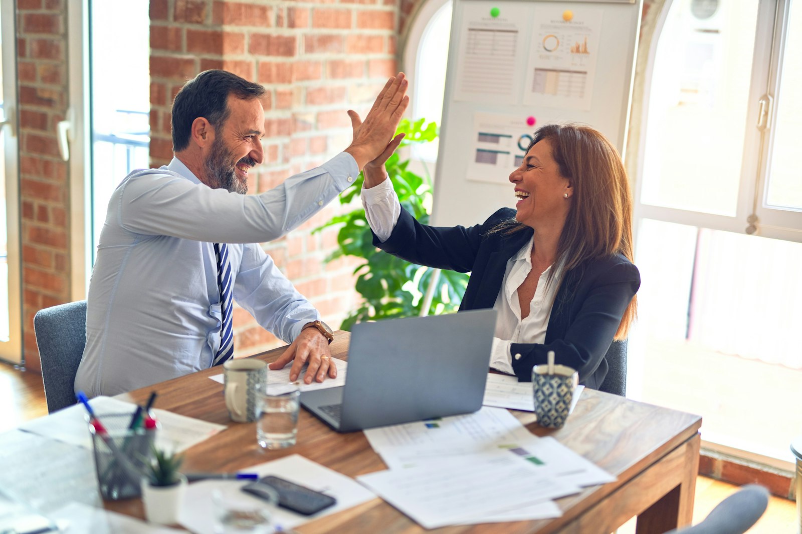 A professional business support team collaborating around a table